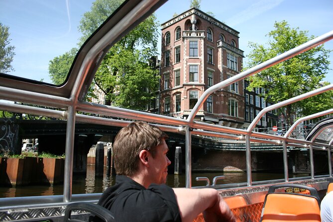 Amsterdam 1h Canal Cruise by Semi-Open Boat with Audio Guide - The Singel, the Munt Tower, and the Old City Edge