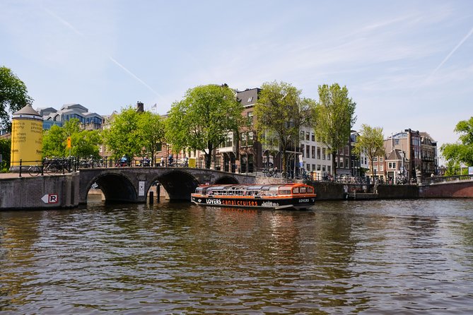 Amsterdam 1h Canal Cruise by Semi-Open Boat with Audio Guide - Magere Brug and Amsterdam’s Bridge Views