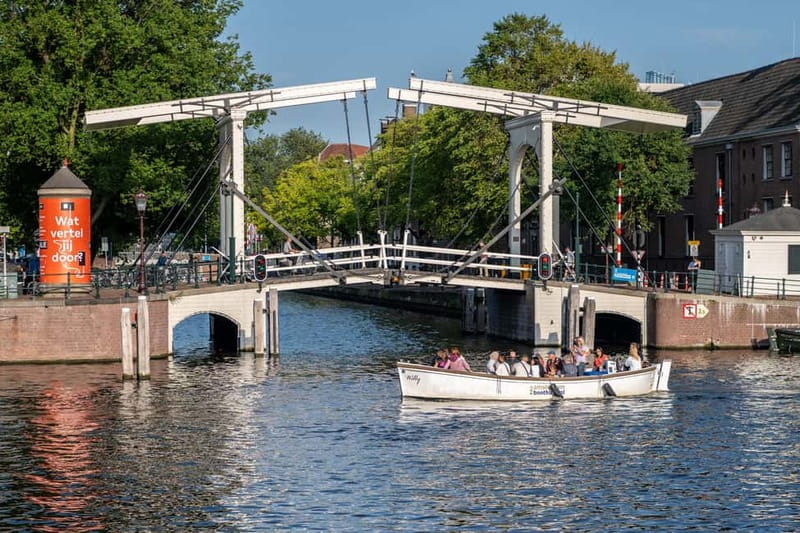 Amsterdam: 75 minute Open Boat Canal Cruise with Live Guide - The Museum Quarter on the return route