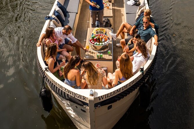 Amsterdam: Canal Booze Cruise with Unlimited Drinks Option - Sailing past Amsterdam’s best-known waterways