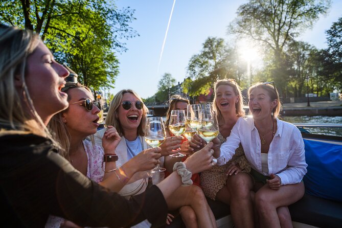 Amsterdam: Canal Booze Cruise with Unlimited Drinks Option - Rain, seating, and boarding concerns