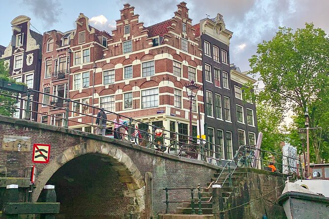 Amsterdam Canal Cruise with German Guide and unlimited drinks - From the old harbor to Amsterdam’s trading past
