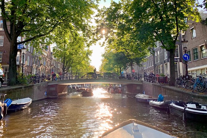 Amsterdam Canal Cruise with German Guide and unlimited drinks - Houseboats and the quieter side of the city