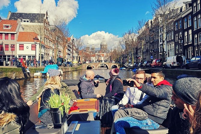 Amsterdam Canal Tour by Open Boat – 90 min Small Group Experience - Munt Tower and the southern edge of De Wallen
