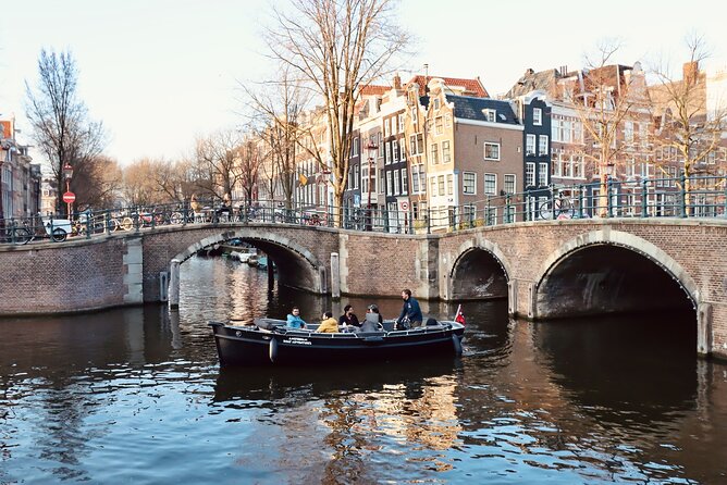 Amsterdam Canal Tour by Open Boat – 90 min Small Group Experience - Small canals and the city’s defensive past