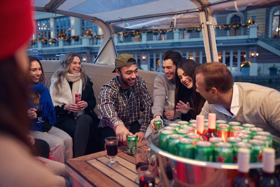 Amsterdam: Covered Canal Booze Cruise with Unlimited Drinks - From the Red Light District to Central Station