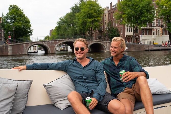 Amsterdam: Evening Candle Light Cruise With Wine & Cheese - Damrak’s Dancing Houses and the grand canals