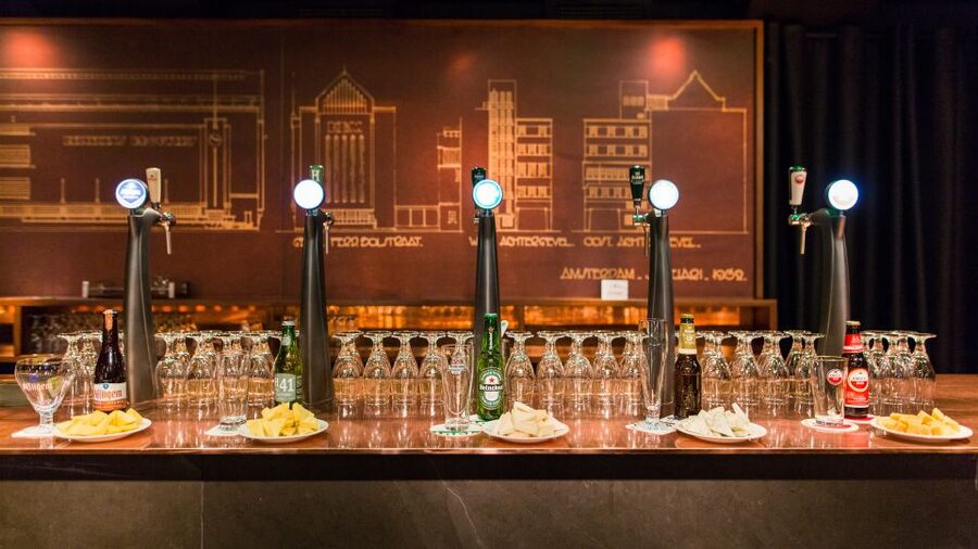 Amsterdam: Exclusive Heineken Experience VIP Tour Ticket - Meeting the guide and following the Heineken story