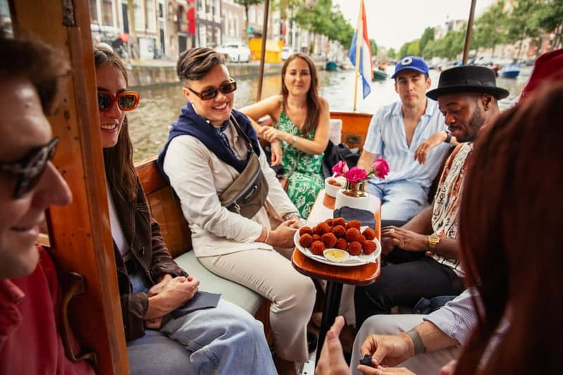 Amsterdam: Food and Canal Tour - One Hour on Amsterdam’s UNESCO-Listed Canals
