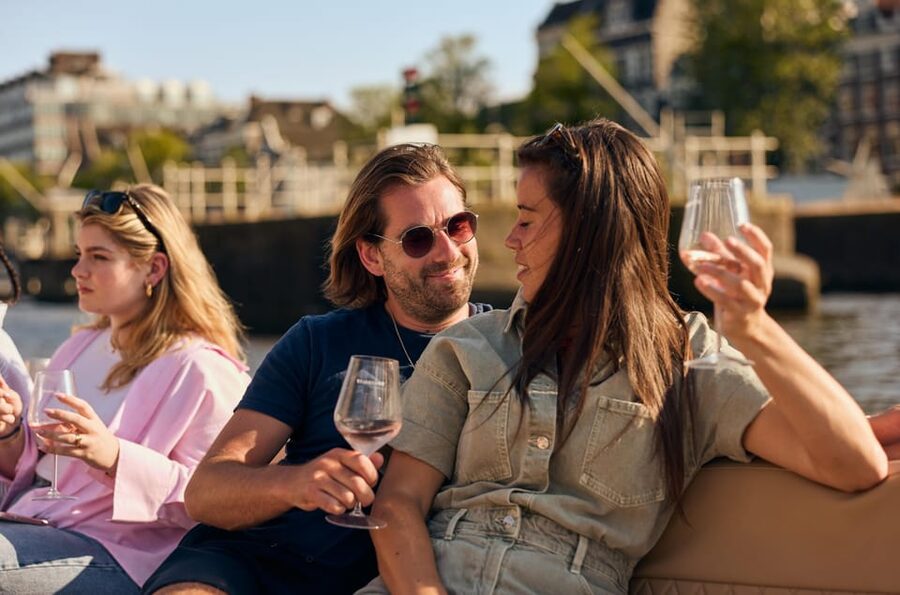Amsterdam: German Guided Canal Cruise with on Board Bar - Zuiderkerk, Munttoren, and the old city core