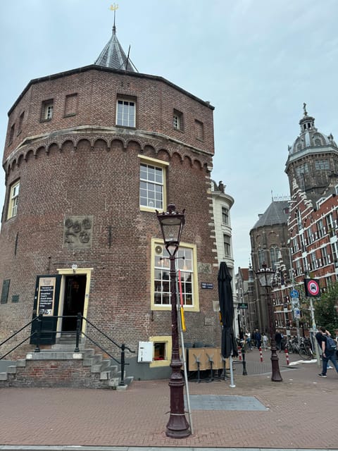 Amsterdam: Ghost Walking Tour and Dark History - Dam Square: the city’s grand center with a darker edge