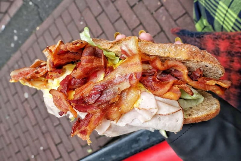 Amsterdam: Guided Food Tour with Tastings - Walking when the city is wet or crowded