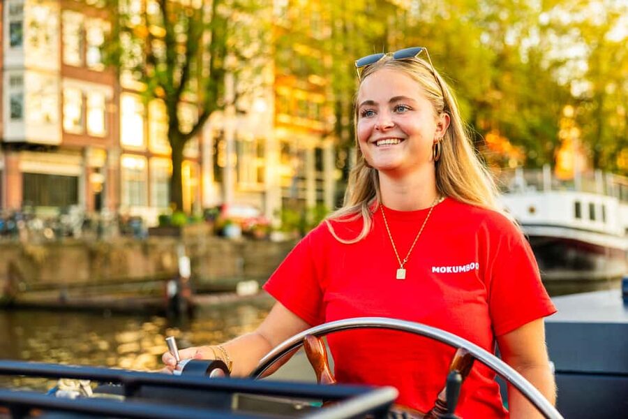 Amsterdam: Guided Open Boat Canal Cruise Including Drink - Weather, timing, and who will enjoy it