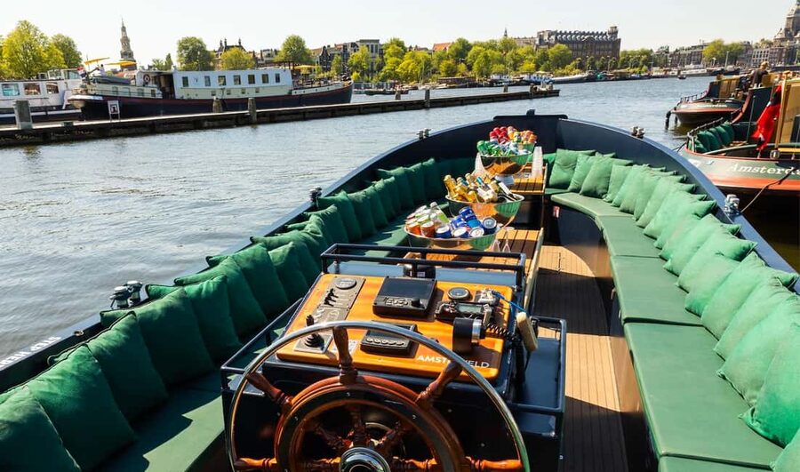 Amsterdam: Guided Open Boat Canal Cruise Including Drink - The western canals and Anne Frank House area
