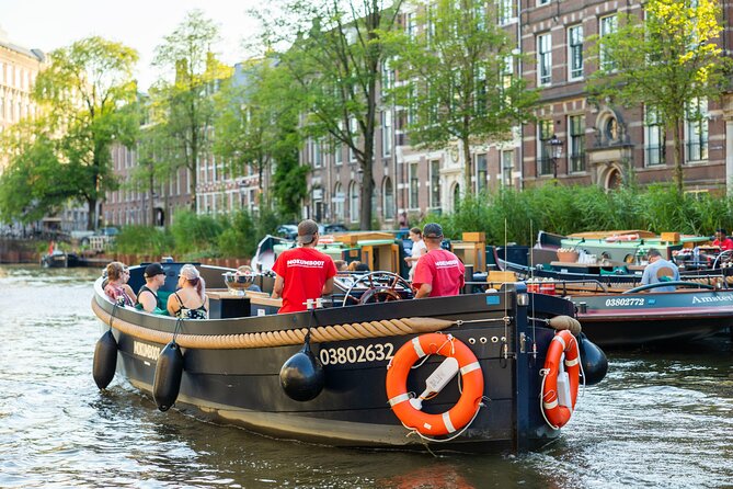 Amsterdam: Guided Open Boat Canal Cruise Unlimited Drinks Option - The Jordaan, houseboats, and Anne Frank
