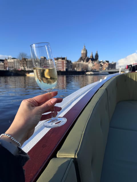 Amsterdam: Historic Boat Cruise with open bar and nibbles - A 1911 salon boat instead of a standard canal launch