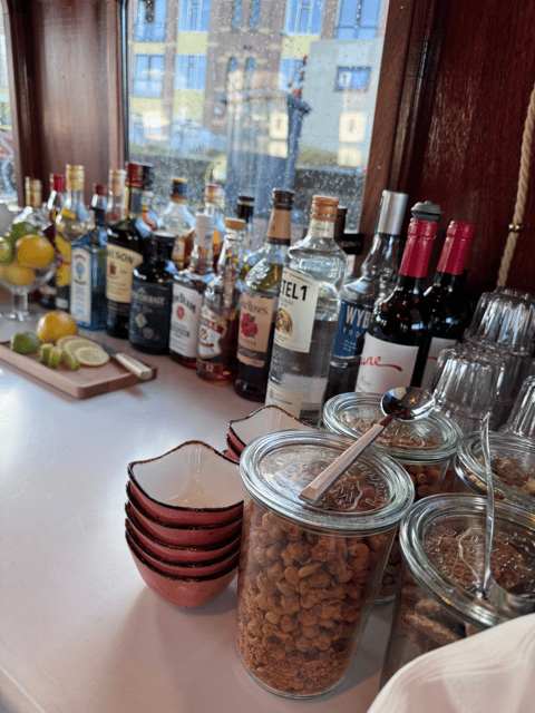 Amsterdam: Historic Boat Cruise with open bar and nibbles - Rain or shine, with two ways to sit