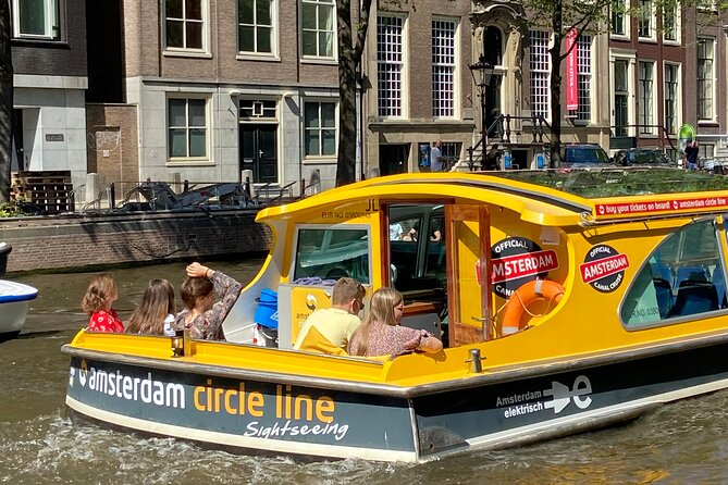 Amsterdam: Historic City Sightseeing Canal Cruise - Boat comfort, seating, and the guide question