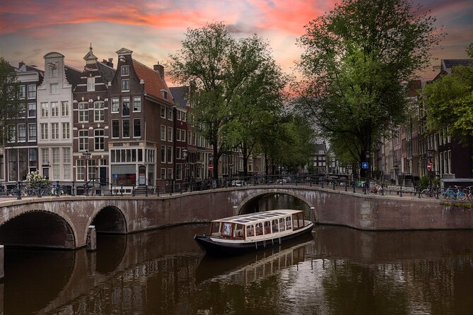 Amsterdam Historic Tour On Classic Saloon Boat - Passing under the Skinny Bridge