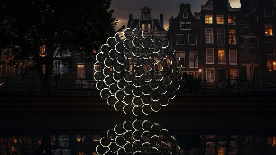 Amsterdam: Light Festival Boat Tour with Warm Drinks - Amsterdam’s canals become the gallery