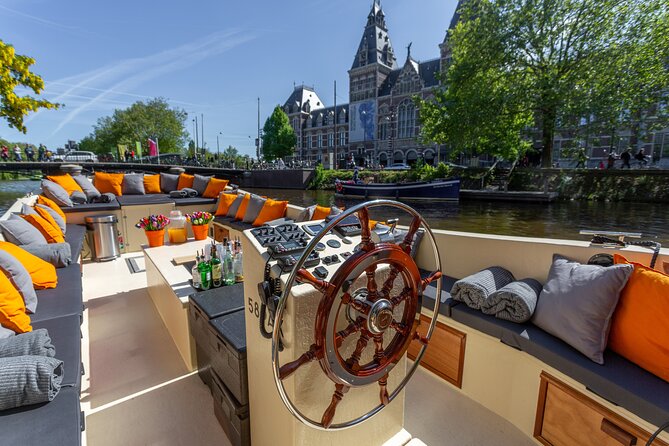 Amsterdam Light Festival: Saloon Boat Cruise + Hot Drinks & Bite - Seeing the Amsterdam Light Festival from the water