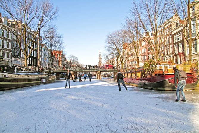 Amsterdam Light Festival Winter Walk with Stroopwafel Workshop - Dam Square and the Royal Palace