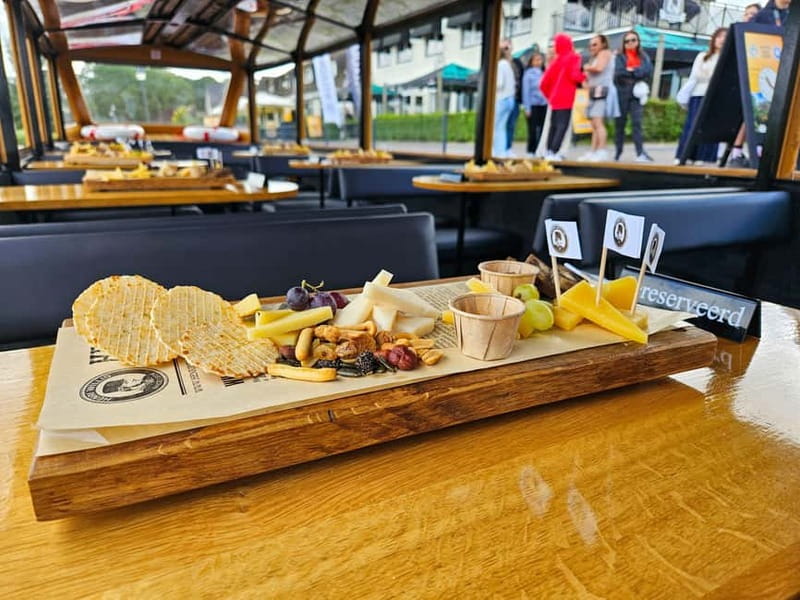 Amsterdam: Live GuideD Giethoorn Boat Tour & Cheese Platter - Arriving in the village of canals and bridges