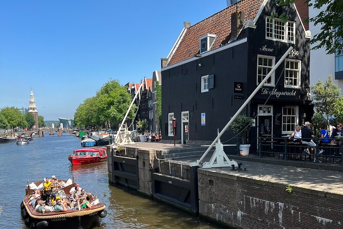 Amsterdam Luxury Boutique Boat tour with Unlimited Beer and Wine - Passing through Amsterdam’s oldest church district