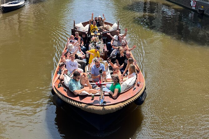 Amsterdam Luxury Boutique Boat tour with Unlimited Beer and Wine - Guides, commentary, and the mood on board