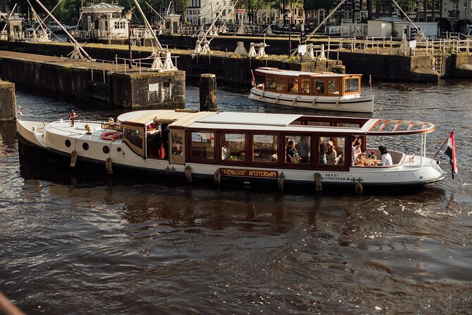 Amsterdam: Luxury Saloon Boat Cruise with Cocktails & Waffle - The Old Church and Amsterdam’s oldest quarter
