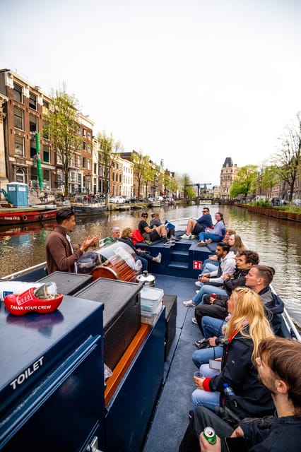 Amsterdam:Old City Canal Cruise with Live Guide and Open Bar - Gliding Through the UNESCO Canal Ring