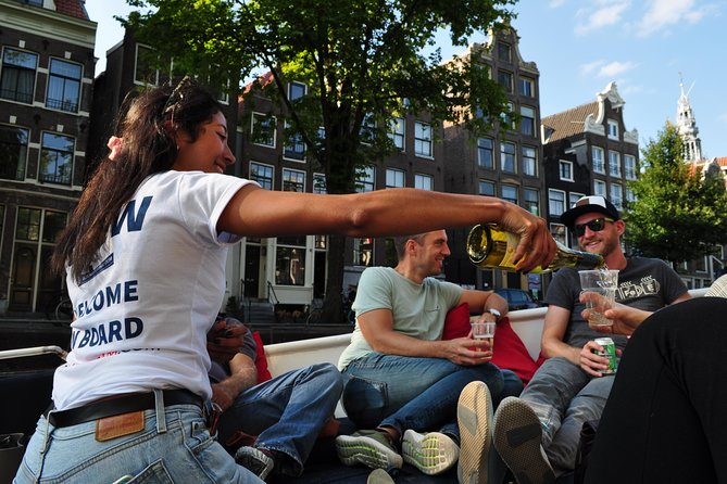 Amsterdam Open Boat Cruise with Live Guide and Two Drinks - Open air, rain, and winter comfort