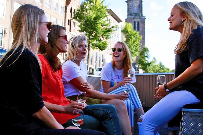 Amsterdam Open Boat Sightseeing Canal Cruise - The Amstel Hotel and the riverfront setting