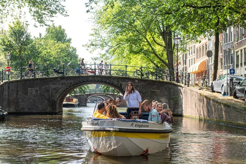 Amsterdam: Open Boat Tour of Canals with Expert Local Guide - Passing Amsterdam Centraal Station