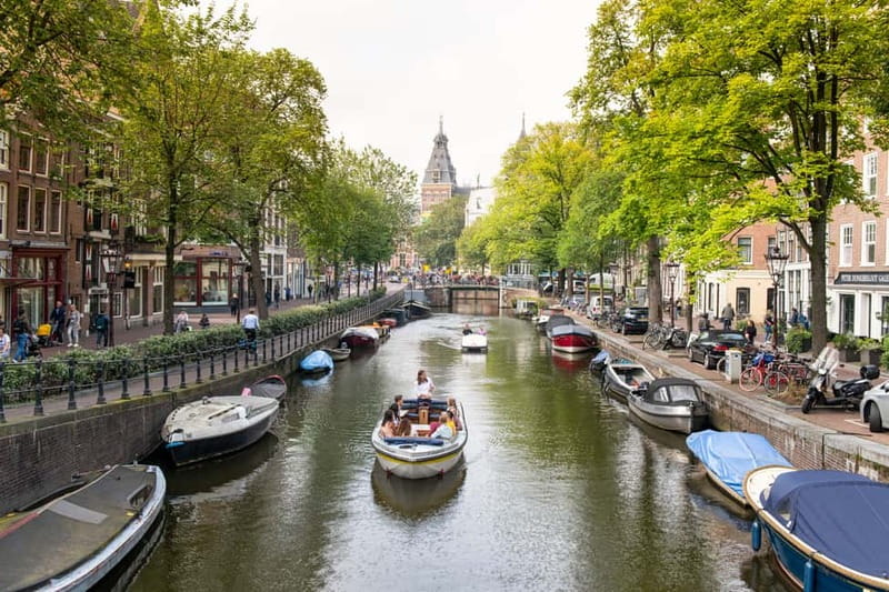 Amsterdam: Open Boat Tour of Canals with Expert Local Guide - Starting near Damrak, Rijksmuseum, or Prins Hendrikkade