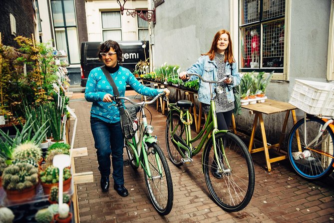 Amsterdam PRIVATE Bike Tour With Locals: Bike & Local Snack Included - Northern routes and countryside alternatives