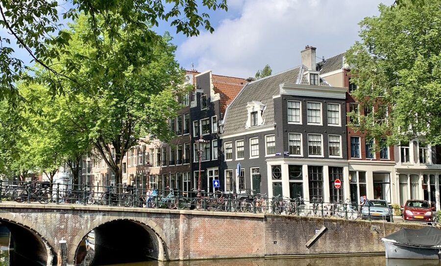 Amsterdam: Red Light District & City Tour German or English - Dancing Houses and the canal belt