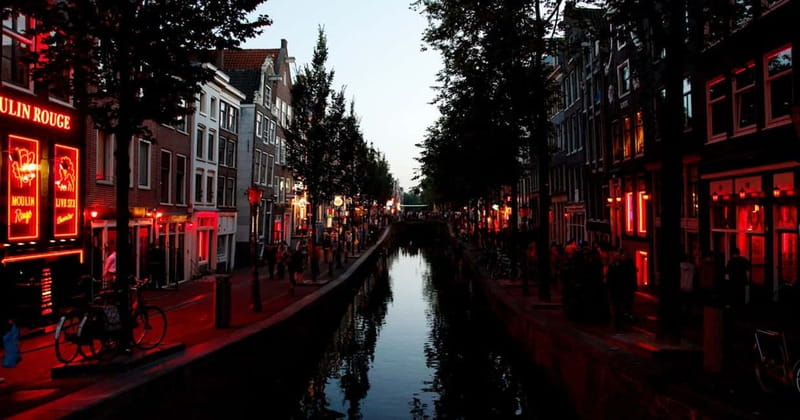 Amsterdam: Red Light District Tour - Beursplein and Dam Square: the city around the subject