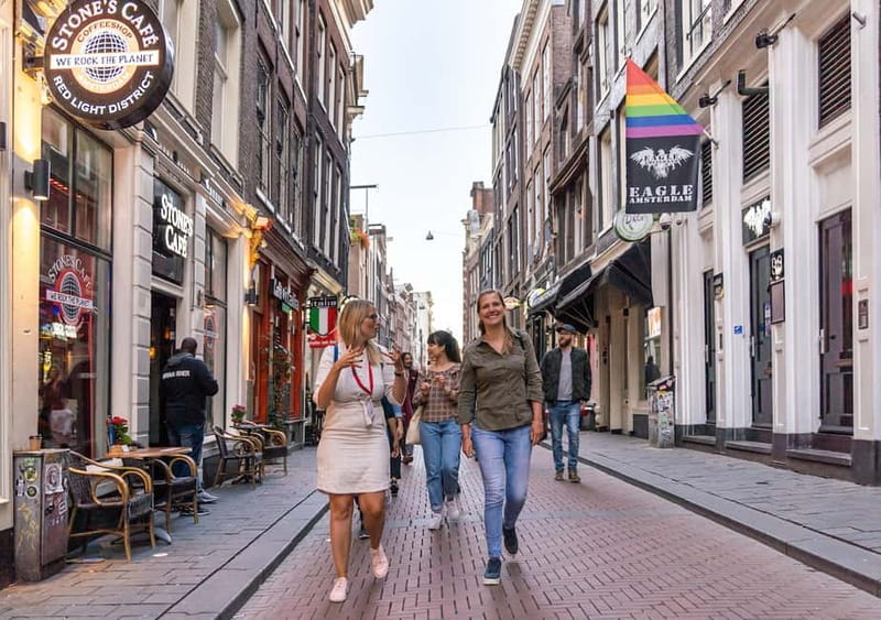 Amsterdam: Red Light District Tour in German/English/Italian - The harbor, Warmoesstraat, and the dancing houses