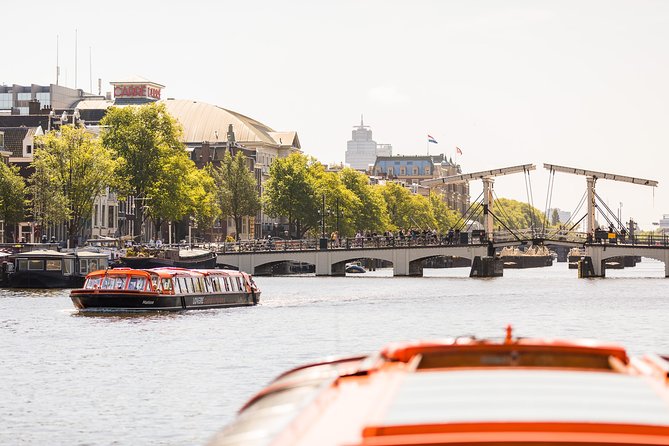 Amsterdam Sightseeing Canal Cruise with Audio Guide - Audio guide, captain, and onboard atmosphere