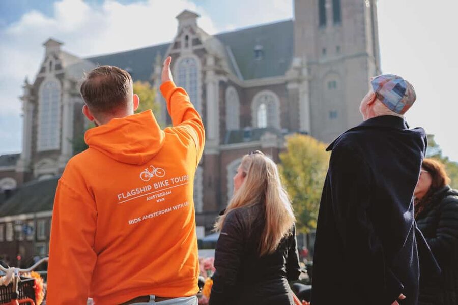 Amsterdam: Top Highlights Guided Bike Tour EN/DE/ES/FR/IT/CN - Starting near Central Station on Nieuwezijds Voorburgwal