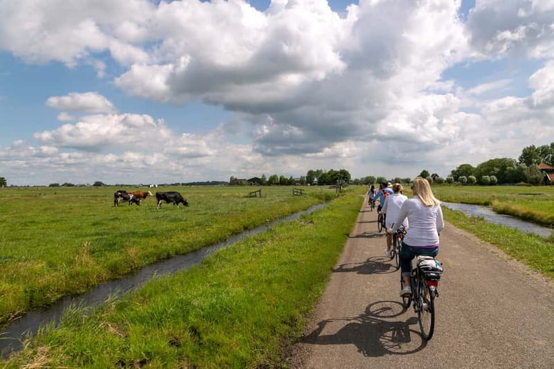 Amsterdam: Windmill, Cheese, and Countryside E-Bike Tour - Leaving Amsterdam by ferry at Piet Heinkade