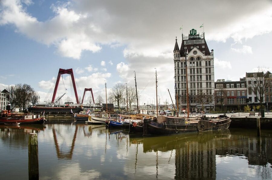 Amsterdam: Zaanse Schans, The Hague & Rotterdam Tour - Rotterdam: old stone beside daring design
