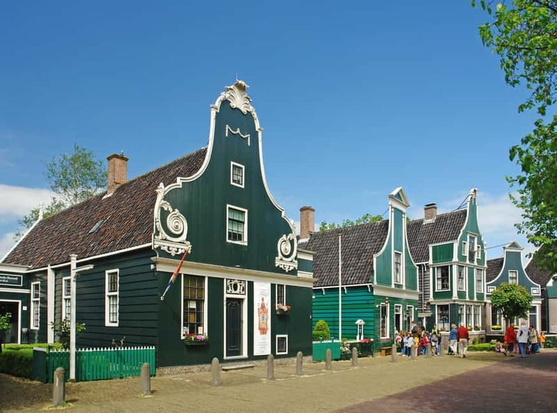 Amsterdam: Zaanse Schans windmills & Volendam Guided Tour - Zaanse Schans: windmills, workshops, and photo stops