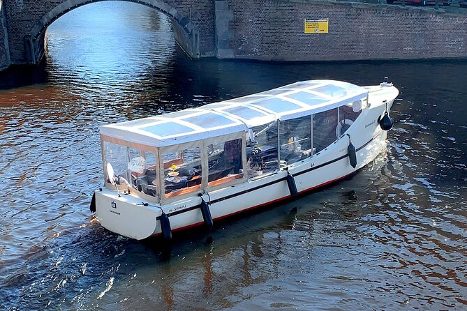 Dutch Cheese & Drinks Guided Amsterdam Boat Tour, All Inclusive - The Oude Kerk and Amsterdam’s sharp contrasts