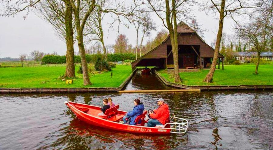 From Amsterdam: Giethoorn Guided Day Trip with Canal Cruise - Walking through Giethoorn before the boat ride