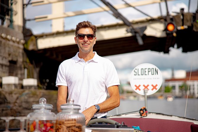 Guided Amsterdam Canal Cruise – Snacks & Drinks on board(1 Hour) - Maritime power beside the water