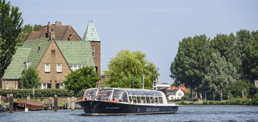 Haarlem: Dutch Windmill & Spaarne River Sightseeing Cruise - The Weighing House and old riverfront buildings