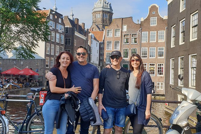Private Amsterdam Red Light District and Coffee Shop Tour - Dam Square and the city built on wooden piles