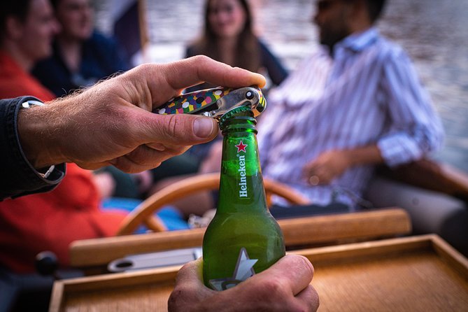 Private Boat Tour Amsterdam - 90 Min incl. welcome drink on historic saloon boat - Nine flexible passages through Amsterdam